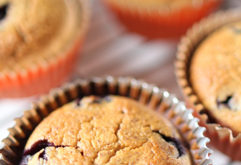 4 blueberry pearch muffins on a tray