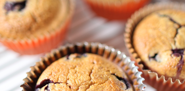 4 blueberry pearch muffins on a tray