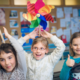 children with pinwheels on their heads