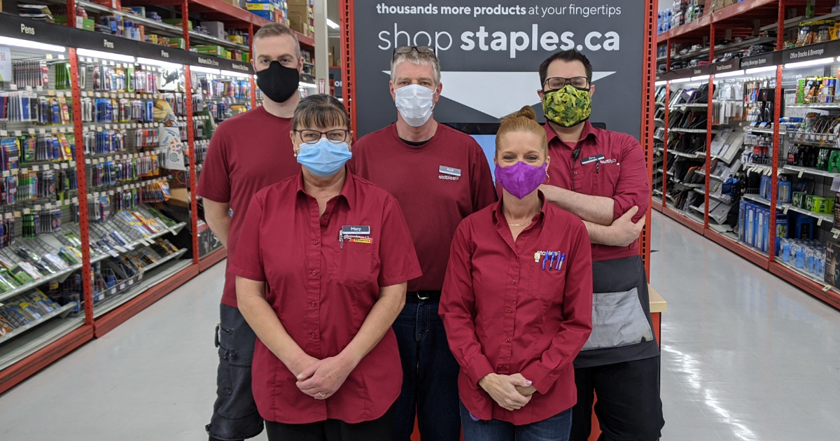 Staples employees posing for a picture