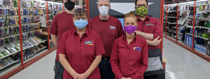 Staples employees posing for a picture