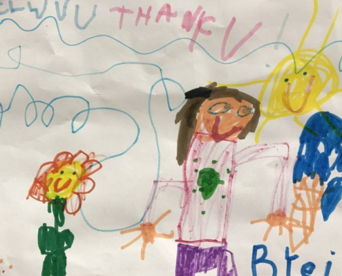 Children drawing of human and flower