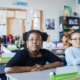 Children sitting in a classroom