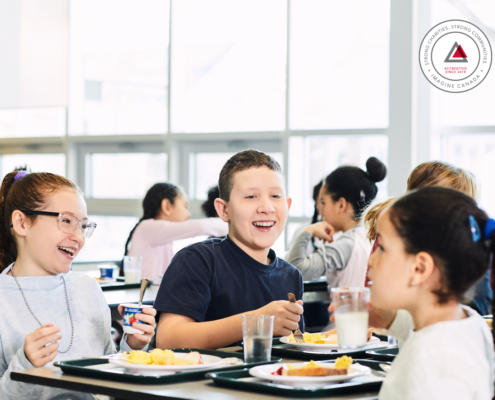 children laughing in cafeteria