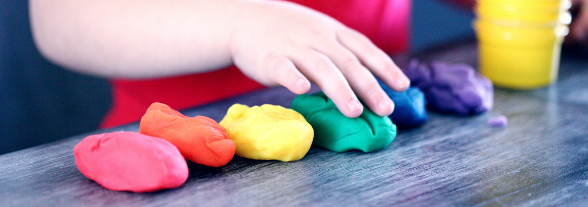 child playing with play-doh
