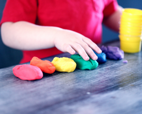 child playing with play-doh