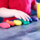 child playing with play-doh