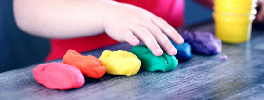 child playing with play-doh