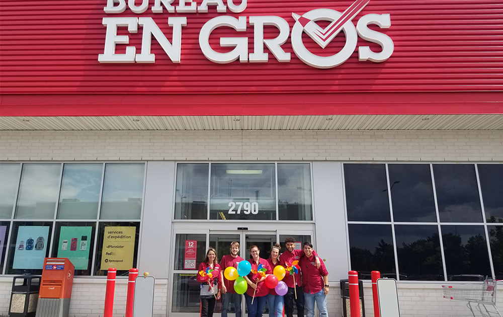 Bureau En Gros employees standing in front of their store
