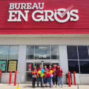 Bureau En Gros employees standing in front of their store