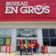 Bureau En Gros employees standing in front of their store