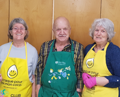 3 elderly folk posing for a picture