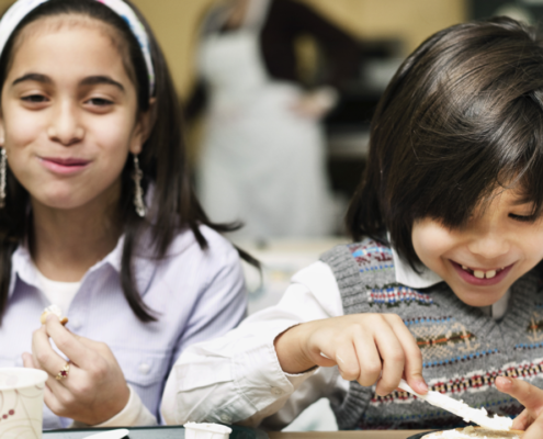 children enjoying breakfast together