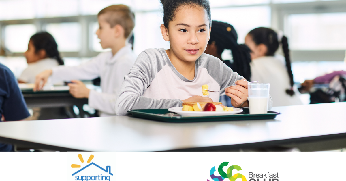 Child eating breakfast in cafeteria