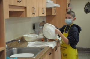 Student doing the dishes