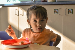 Little girl eating breakfast