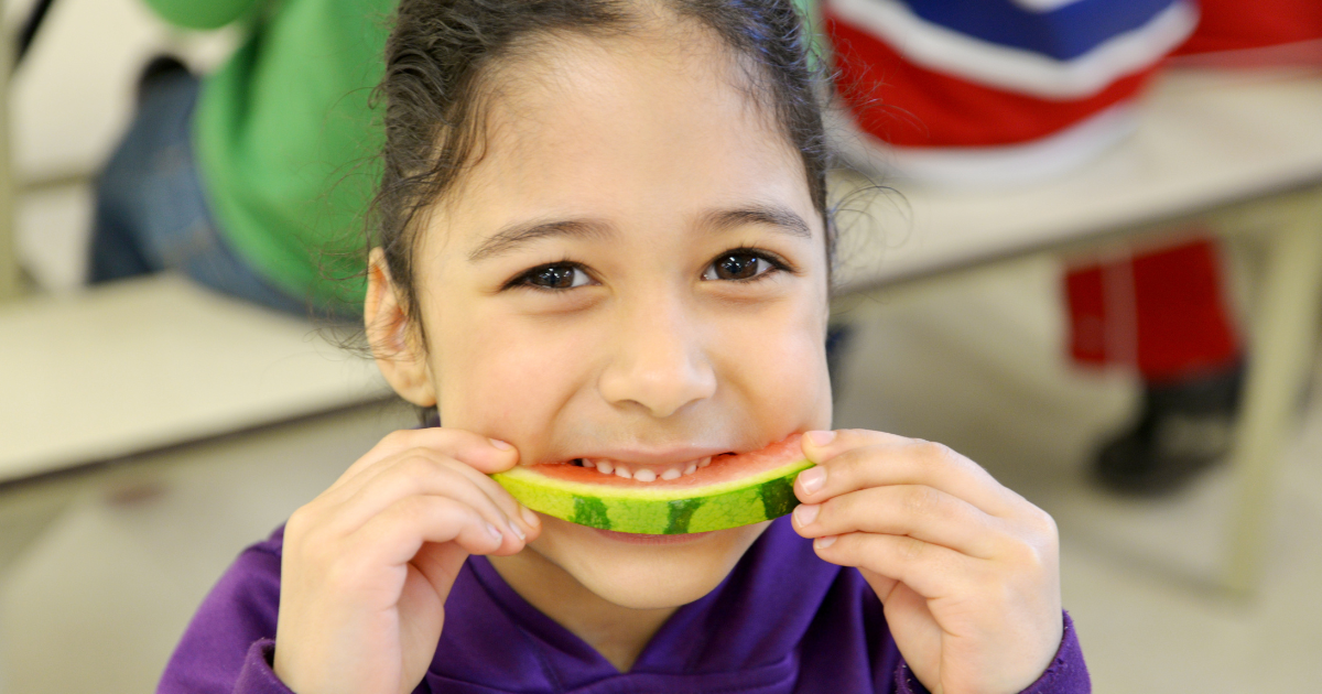 girl eating watermelon