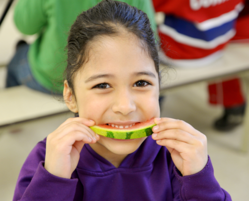 girl eating watermelon