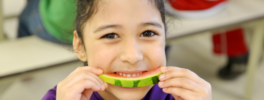 girl eating watermelon