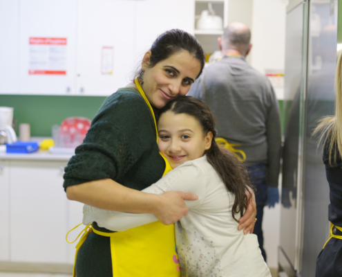 volunteer and student hug